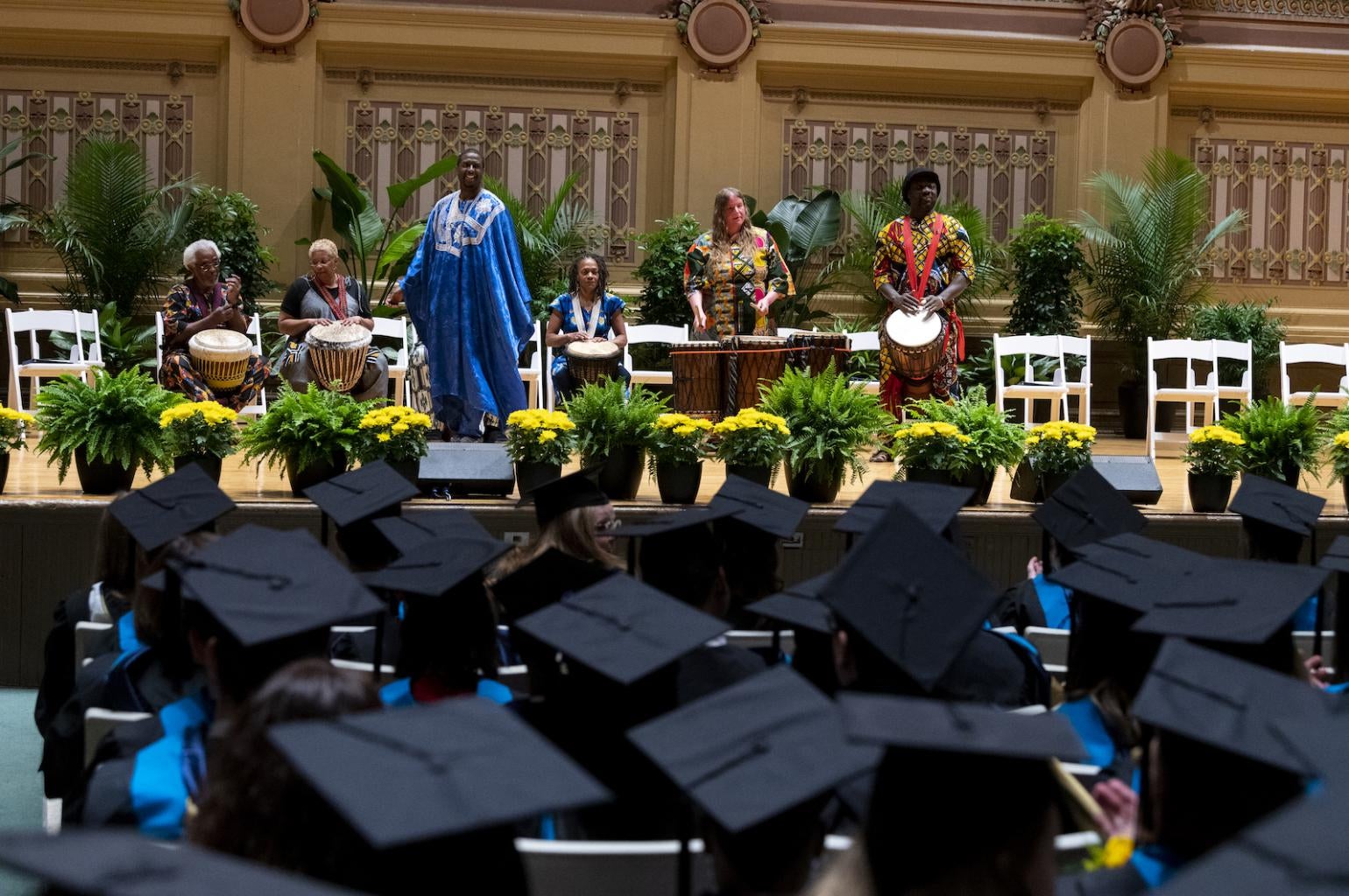 "The Shona Sharif African Drum and Dance Ensemble leads the Processional."