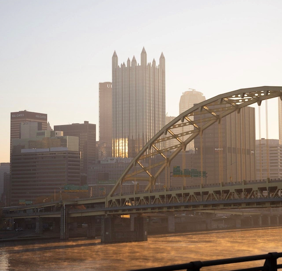 "Sunset view of downtown Pittsburgh and yellow bridge"