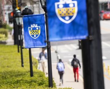 Students walking on campus at Pitt