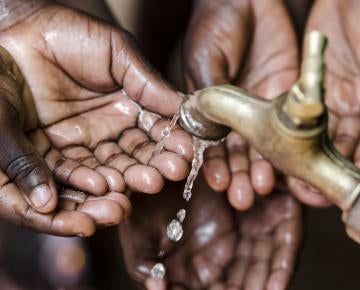 hands under running water