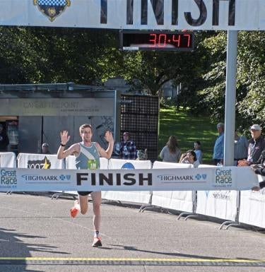 Nick Wolk crosses race finish line