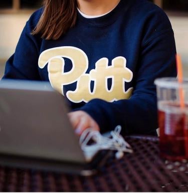 Pitt student on laptop
